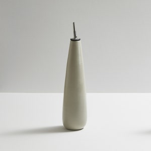 Modern handmade ceramic oil/vinegar bottle. Exceptionally handcrafted. Available in white, blue grey, sage green, grey, and black.