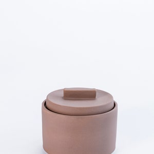 Modern handmade ceramic storage container. Exceptionally handcrafted. Available in white and cinnamon. Cinnamon