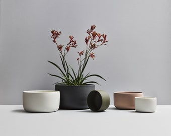 Modern handmade ceramic planter. Exceptionally handcrafted. Available in white, sand, moss green, and black.