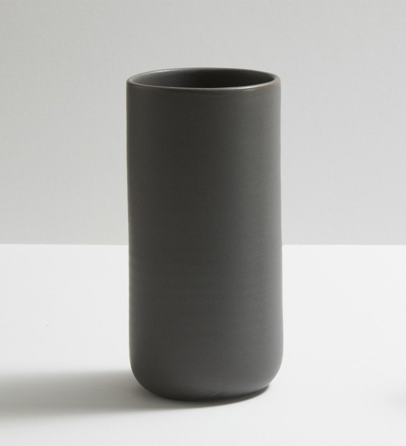 Modern handmade ceramic vase. Exceptionally handcrafted. Available in white, blue grey, sage green, grey, sand and black. Black