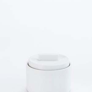 Modern handmade ceramic storage container. Exceptionally handcrafted. Available in white and cinnamon. White