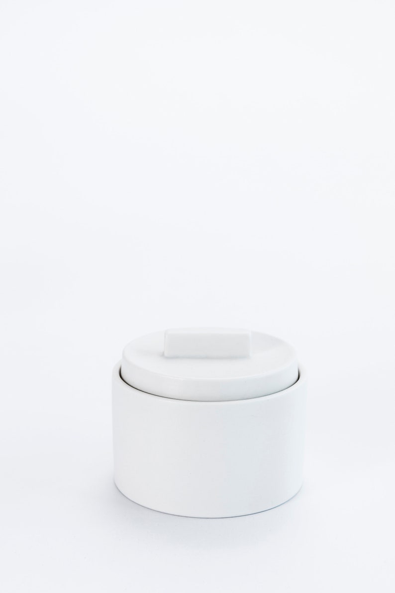 Modern handmade ceramic storage container. Exceptionally handcrafted. Available in white and cinnamon. White