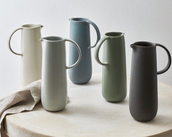 Modern handmade ceramic carafe. Exceptionally handcrafted. Available in white, blue grey, sage green, grey, and black.
