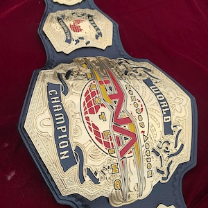 TNA World Heavyweight wrestling championship belt, 4mm zinc, Gold plated. Real leather strap. adult size
