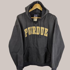 May include: Black hooded sweatshirt with a gold embroidered Purdue logo.