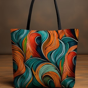 May include: A tote bag with a colourful abstract design featuring swirling lines in shades of orange, blue, and green.