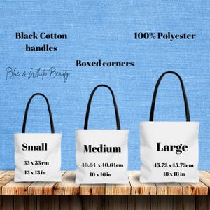 May include: Three white tote bags with black handles and boxed corners. The bags are labelled "Small", "Medium", and "Large" with measurements in inches and centimetres. The bags are made from 100% polyester with black cotton handles.