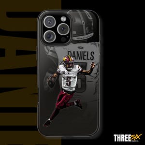 May include: Black phone case featuring a football player in a white and burgundy uniform with the number 5. The player is running with a football. The name "DANIELS" is visible. The case has a black border and a Three Six Design Co. logo.