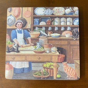May include: A vintage kitchen scene with a woman in a blue and white dress preparing food. There are bowls, jars, and a rolling pin on the counter. A cat is sitting on the floor, looking up at a basket of apples. The text "Jenny Barron" is in the bottom left corner.