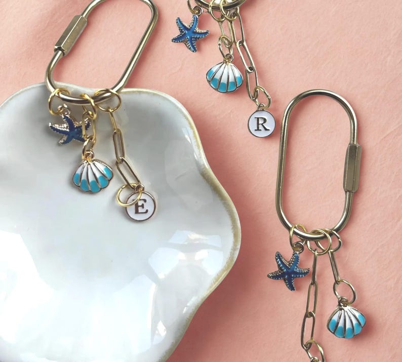 Ocean-themed keychain clip featuring ‘Last Toast On the Coast’ charm, blue seashell and starfish, perfect coastal reminder or travel accessory for bachelorette trips