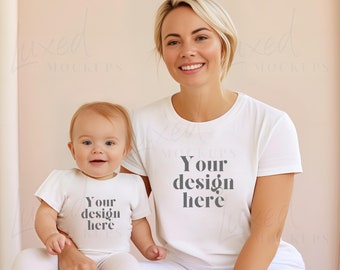 May include: A mother and child wearing white t-shirts with the text "Your design here" printed on them. The mother is smiling and the child is looking at the camera.