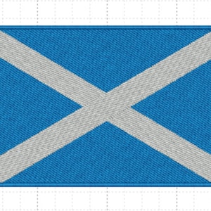 Puede incluir: Un parche bordado con la bandera de Escocia. La cruz blanca está centrada en un fondo azul.