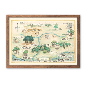 May include: A hand-drawn map of the Hundred Acre Wood from Winnie the Pooh, featuring locations like Pooh's House, Rabbit's Burrow, Owl's House, and Eeyore's Gloomy Place. The map is framed in a brown wood frame.