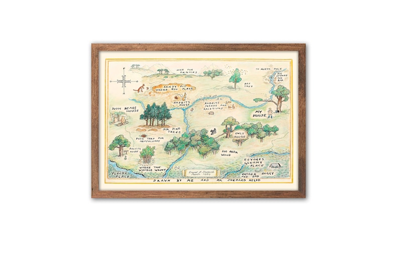 May include: A hand-drawn map of the Hundred Acre Wood from Winnie the Pooh, featuring locations like Pooh's House, Rabbit's Burrow, Owl's House, and Eeyore's Gloomy Place. The map is framed in a brown wood frame.