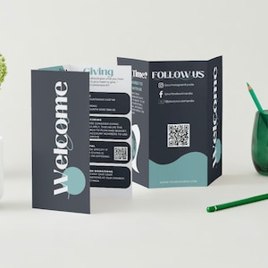 May include: A tri-fold brochure with a dark blue background and teal accents. The front panel says "Welcome" in a stylized font. The second panel has the heading "Giving" and lists information about giving to the church. The third panel has the heading "Follow Us" and includes social media handles and a QR code. The back panel says "Welcome" in a stylized font.