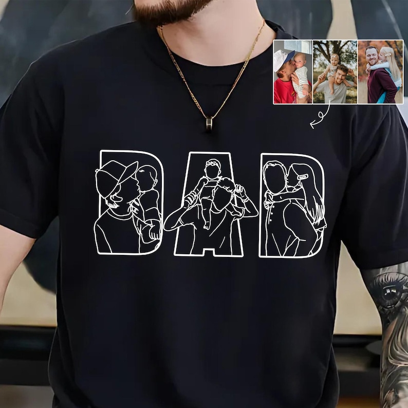 Peut inclure: T-shirt noir avec le mot "DAD" en blanc, chaque lettre repr&eacute;sentant un dessin au trait d'un parent avec un enfant. Comprend un petit encart de trois photos en couleur de parents et d'enfants.