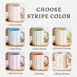 May include: Ceramic mugs with vertical stripe designs in various colors, including dusty pink, baby blue, sage green, butter yellow, muted lilac, orange, and warm brown. The text "CHOOSE STRIPE COLOR" is displayed.