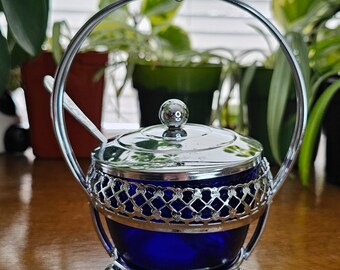 Small collector's sugar bowl with Spoon in cobalt blue with chrome metal. It is in Excellent condition.