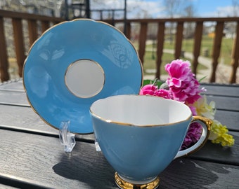Robin's Egg Blue Sheridan Bone China footed tea cup and saucer Teacup Duo with Lusterous gold trim. Made In England