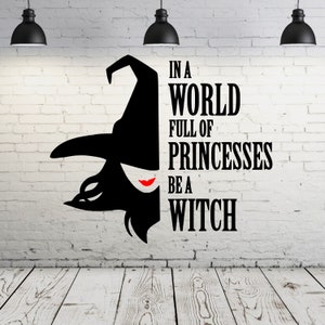 May include: Black and white silhouette of a witch with a pointed hat and red lips on a white brick wall. The text "In a world full of princesses be a witch" is written in black letters.