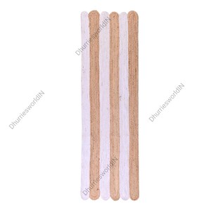 May include: A long, narrow jute rug with alternating stripes of natural jute and white. The rug has a slightly frayed edge.