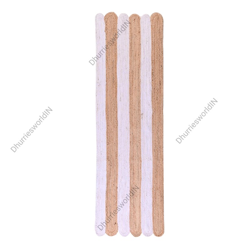 May include: A long, narrow jute rug with alternating stripes of natural jute and white. The rug has a slightly frayed edge.