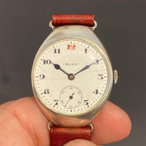Silver wristwatch by Doxa officers watch from the WW1 period around 1916/18 Swiss produced Cushion shaped silver case very rare
