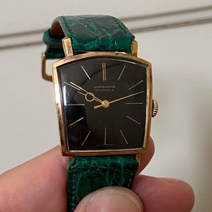 Linterna Junghans extremadamente rara de la década de 1950, chapada en oro, con caja de depósito, movimiento de cuerda manual, J84/S, esfera negra, funciona imagen 4