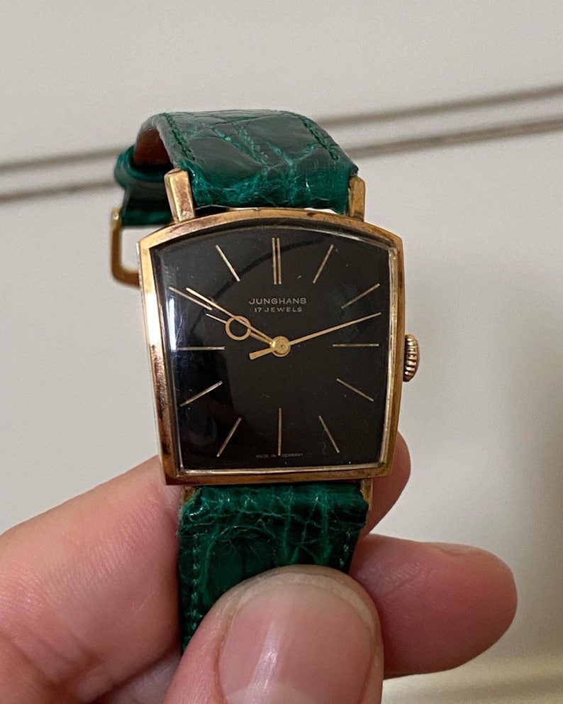 Linterna Junghans extremadamente rara de la década de 1950, chapada en oro, con caja de depósito, movimiento de cuerda manual, J84/S, esfera negra, funciona imagen 4