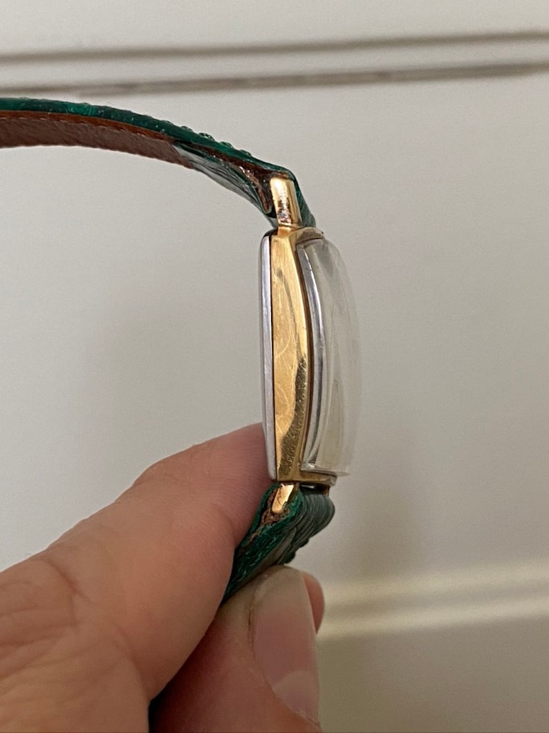 Linterna Junghans extremadamente rara de la década de 1950, chapada en oro, con caja de depósito, movimiento de cuerda manual, J84/S, esfera negra, funciona imagen 6