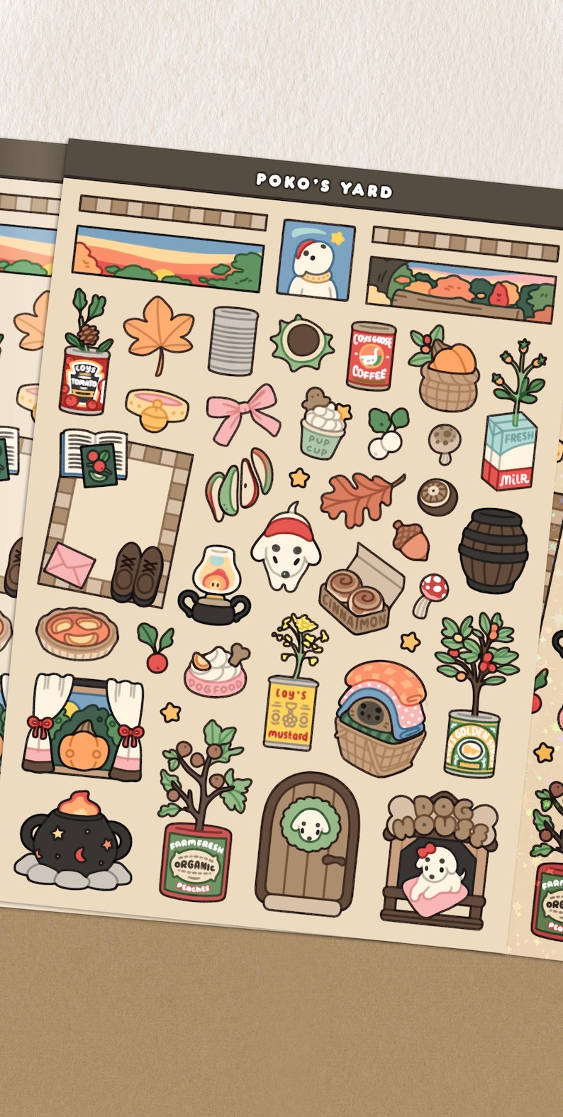 May include: Sheet of stickers featuring various autumn-themed illustrations. Includes images of a dog, leaves, food items, and the text "POKO'S YARD". The stickers are in a cartoon style with a warm color palette.