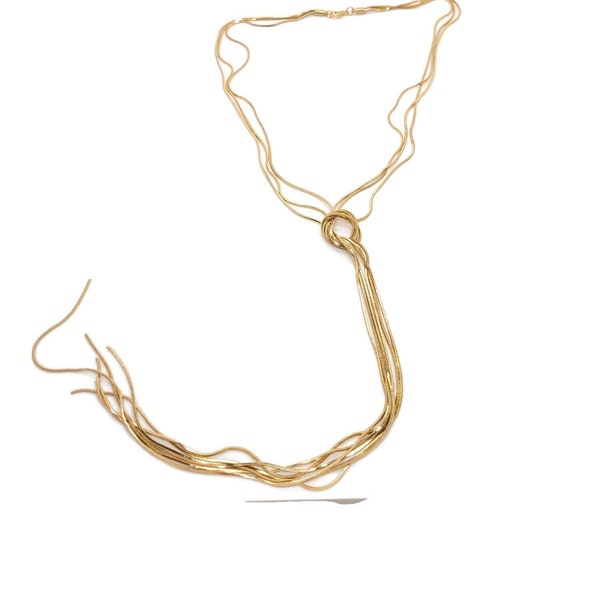 Collier sautoir doré avec noeud