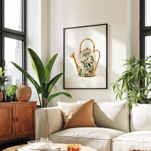 Peut inclure: Un arrosoir dor&eacute; avec un motif de cage &agrave; oiseaux rempli de fleurs et de verdure. L'arrosoir est sur un fond blanc avec un cadre noir.