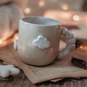 Handmade ceramic mug decorated with cloud