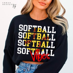 May include: Black sweatshirt with the words "Softball Vibes" in white letters with a yellow and red softball graphic.