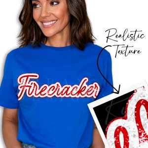 May include: Royal blue t-shirt with the word "Firecracker" in a red and white distressed font. The shirt has a crew neck and short sleeves. The image also shows a close-up of the text with a realistic texture.