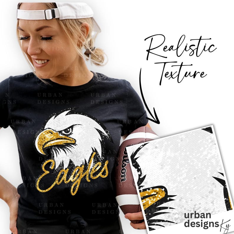 May include: A black t-shirt with a gold glitter eagle graphic and the word "Eagles" in gold glitter. The shirt is being held by a person wearing a white baseball cap. The image also shows a close-up of the eagle graphic with a realistic glitter texture.