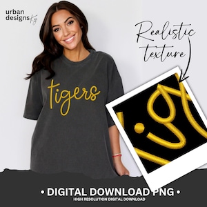 May include: A digital download of a gold embroidered "tigers" text graphic with a realistic texture. The graphic is shown on a black t-shirt.