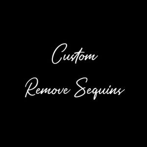 May include: Black background with white cursive text that reads "Custom Remove Sequins". The text is in a handwritten style, suggesting a personalized service or product modification.