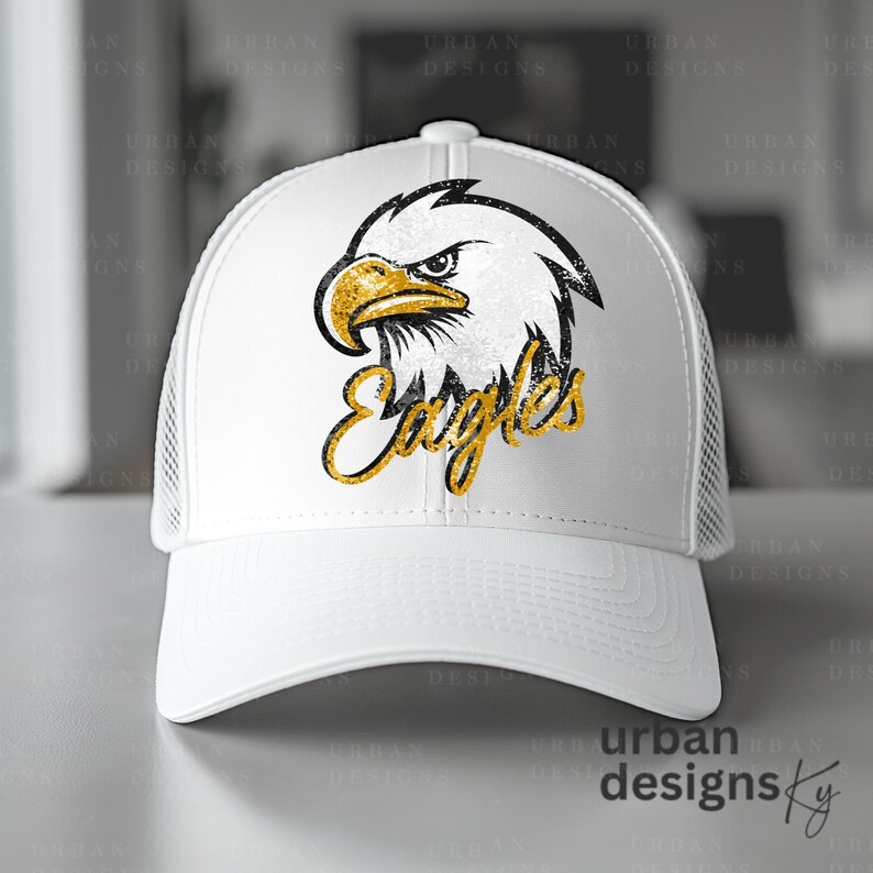 May include: White trucker hat with a black and gold glitter eagle graphic and the word "Eagles" in gold glitter.