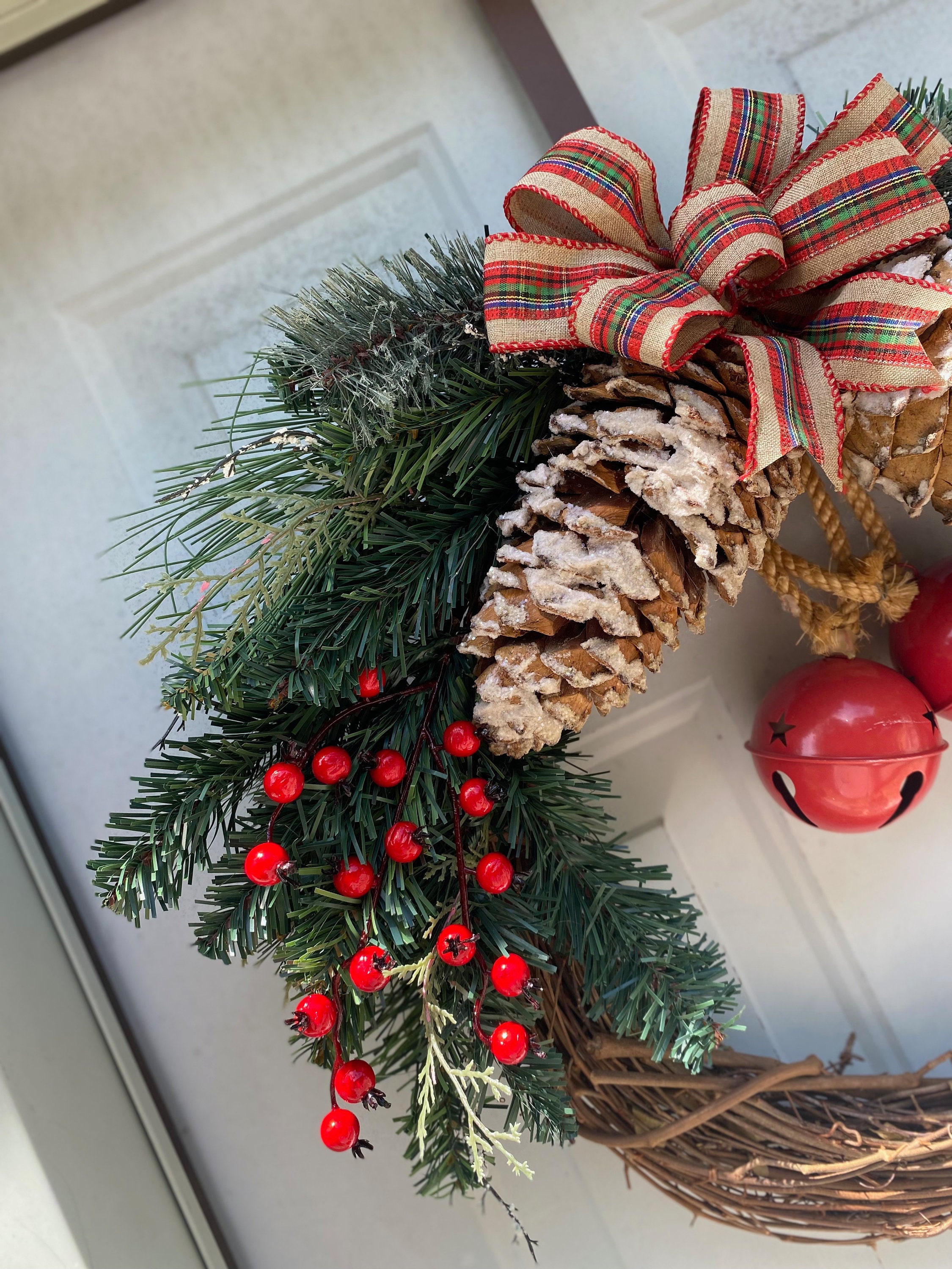 Festive Holiday Wreath With Pine Cones, Red Berries, and Jingle Bells ...