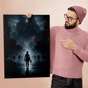 Designer holding a printed version of the dark apocalypse poster, showcasing the physical print quality and detail. The image reflects the effort, precision, and creative process behind crafting each dramatic composition with care and dedication.