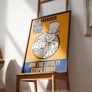 Framed retro-inspired recruitment style poster displayed on a wooden easel in a bright modern interior. The artwork features a cheerful illustrated mascot pointing toward the viewer with bold blue and golden yellow colors, vintage propaganda-inspired typography and classic comic styling. Designed for retro gaming decor, sci fi wall art, post-apocalyptic themed rooms, gaming graphics collections and movie poster inspired interiors while remaining suitable for contemporary home or office display.