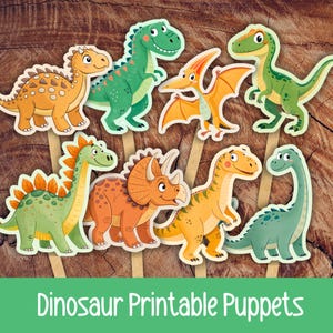 May include: A collection of colorful dinosaur puppets on wooden sticks. The puppets feature various dinosaur species in shades of green, orange, yellow, and blue. The text "Dinosaur Printable Puppets" is at the bottom.