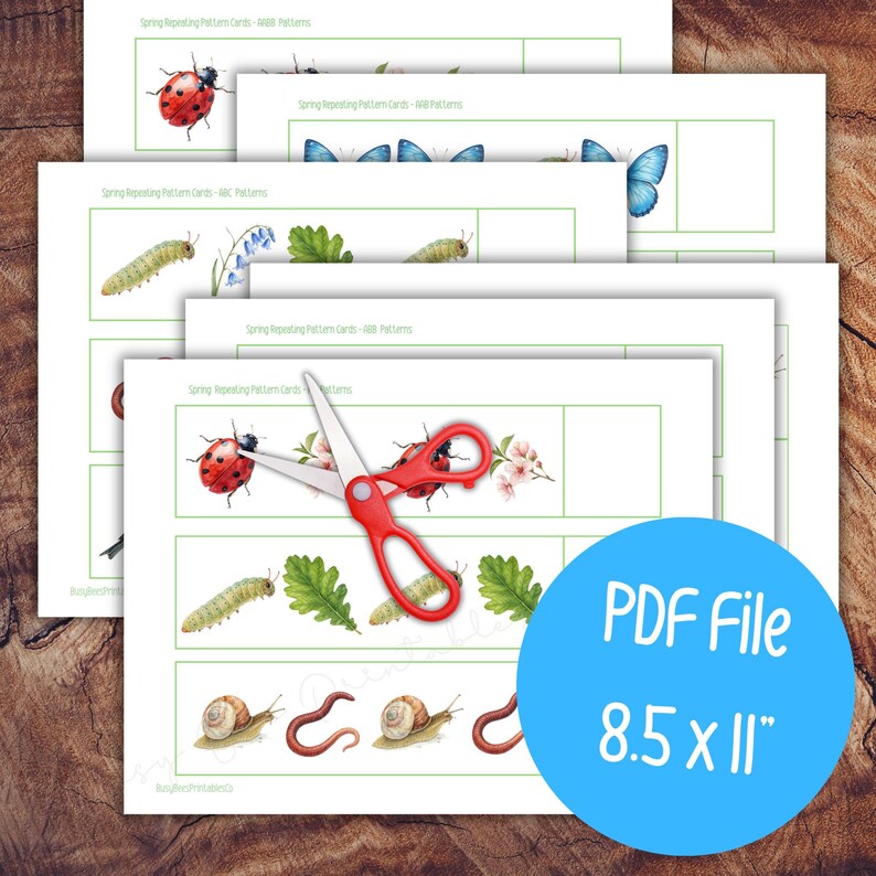 May include: Printable pattern cards featuring spring-themed illustrations of ladybirds, butterflies, caterpillars, and snails. A pair of red scissors rests on the cards. The blue circle indicates the PDF file size is 21.6 x 27.9 cm.
