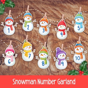 May include: A snowman number garland with ten snowmen, each with a different number from 1 to 10. The snowmen have colorful hats, scarves, and twig arms. The garland is strung on a twine rope, with a wooden background.