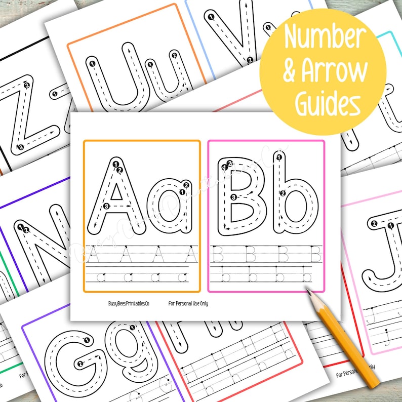 May include: White paper sheets with black outlined uppercase and lowercase letters, featuring dotted lines for tracing. The sheets include the text "Number & Arrow Guides" and "BusyBeesPrintablesCo For Personal Use Only". A yellow pencil rests on the sheets.