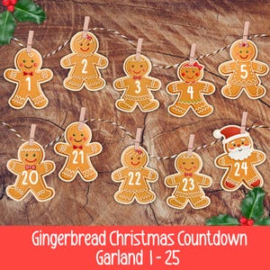 May include: A gingerbread Christmas countdown garland with numbers 1-25. The gingerbread men are strung on a string and held by clothespins. The garland is set against a wood background with holly leaves and berries.