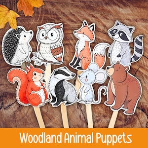 May include: A collection of woodland animal puppets, including a hedgehog, owl, fox, raccoon, squirrel, badger, mouse, and bear. Each puppet is a colorful illustration on a wooden stick, set against a wood grain background. The text "Woodland Animal Puppets" is at the bottom.