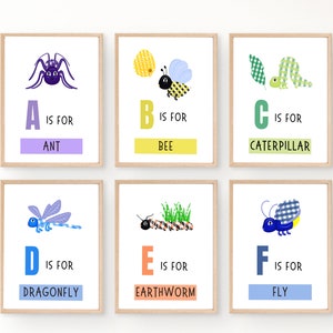 May include: Six colorful alphabet posters with illustrations of insects and the letters A through F. Each poster has a letter, the word "is for", and the name of the insect. The letters are in a bold, colorful font. The insects are illustrated in a cartoon style.